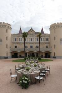 Outdoor wedding reception with spiral table layout at Castle of Viñuelas